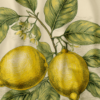 **Alt Text:** Close-up of a vintage botanical illustration featuring two detailed yellow lemons on a branch, surrounded by lush green leaves and delicate white blossoms. The artwork is printed on a cream-colored shower curtain, with fine lines and stippling giving it an old-world, engraved appearance.